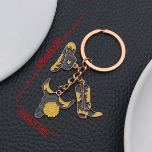 Detail view of Western cowboy keychain charms with sizes marked on black leather