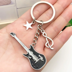 Rock music themed black guitar keychain with silver treble clef and star charm