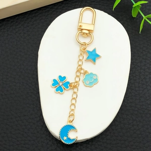 Golden alloy U-shaped keychain with blue enamel star moon clover and smiling cloud charms