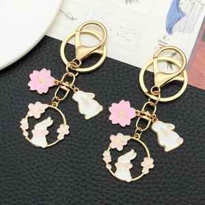 Chinese style cherry blossom rabbit keychain with gold alloy ring and pink floral charms