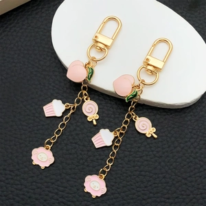 Cute pink enamel peach cupcake sheep charms on gold metal lobster clasp keychain
