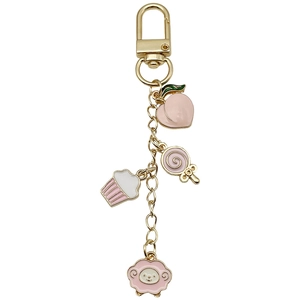 Pink enamel peach sheep and cupcake charms on a gold U-shaped metal keychain