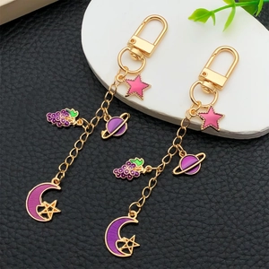 Lot de porte-clés dorés avec pendentifs émaillés d'étoile et lune pour sacs élégants