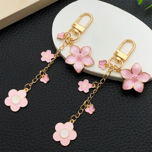 Pink sakura cherry blossom and butterfly keychain with gold alloy swivel snap hook