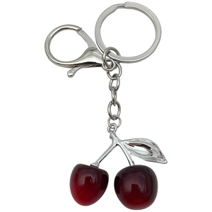 Creative red resin cherry keychain with silver metal lobster clasp on white background
