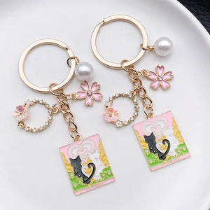 Pink heart cat tarot keychain with cherry blossoms and pearls in gold finish