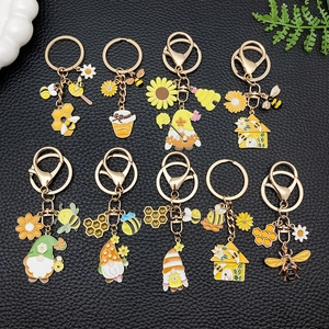 Niedliches Bienen und Sonnenblumen Emaille Schlüsselanhänger Set mit gelben Honig Gnomes