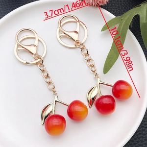 Porte-clés cerise mignon en résine avec dégradé rouge jaune et pendentif doré