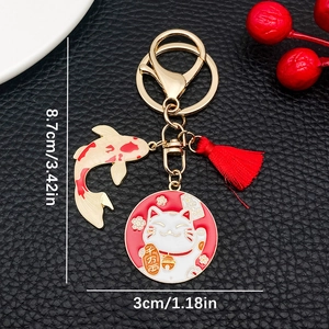 Japanese Maneki Neko lucky cat keychain with red tassel and koi fish charm
