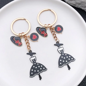Elegant ladies dress and hat zinc alloy keychain with gold hardware and polka dot pattern