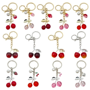 Set of creative resin cherry keychains in various colors with pearls and lobster clasps