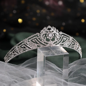 Macro detail of bridal crown featuring intricate silver alloy patterns and rhinestones