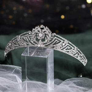 Detailed macro view of sparkling silver rhinestone bridal tiara with intricate floral patterns