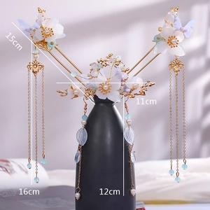 Detailed view of Chinese hair stick set with golden tassels and delicate blue beads