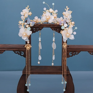 Detail of vintage Chinese floral hair crown and long tassel earrings with purple butterflies
