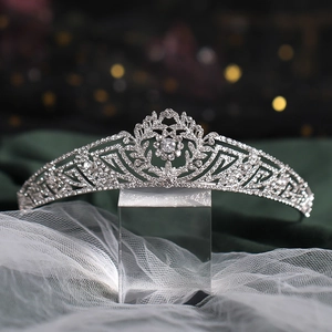 Close-up of silver bridal tiara with sparkling rhinestones and elegant floral patterns