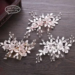 Elegant bridal floral hair comb with metal leaves, rhinestones, and crystals set on wood
