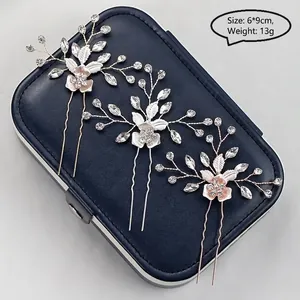 Three-piece set of bridal floral hair pins with rhinestones and alloy leaves for wedding
