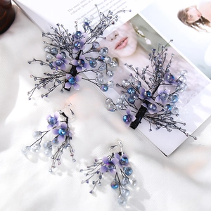 Handmade bridal hair clips and earrings set with purple fabric flowers and crystals