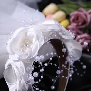 Elegant white floral headband with pearls and tulle veil for girl's party and performance