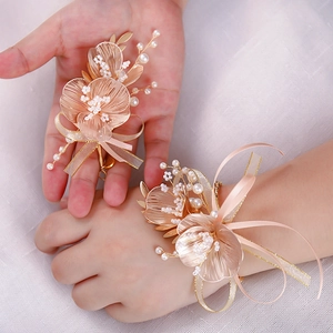 Champagne gold floral wrist corsage and boutonniere set with pearls for weddings
