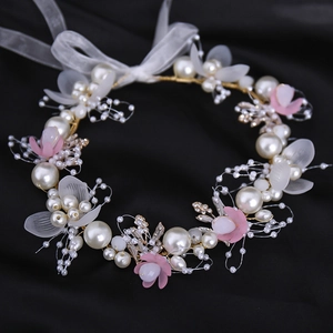 Handmade bridal headband with white pearls, pink flowers and golden leaves on black background