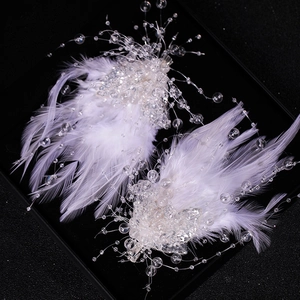 Elegant pair of white feather hair clips with clear acrylic beads and silver sequins