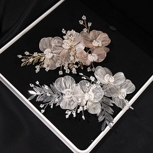 Elegant floral bridal headband with metallic wire petals and pearls for evening dresses