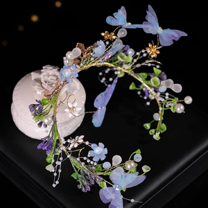 Serre-tête artisanal style forêt avec papillons en gaze bleue et perles sur fil doré
