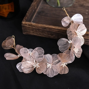 Handmade rose gold metal wire floral hair accessory with pearls for bridal styling