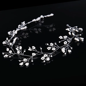 Handmade bridal pearl hair vine with silver wire leaf design for wedding hairstyles
