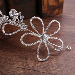 Exquisite bridal silver flower headband featuring hollow design and brilliant rhinestones