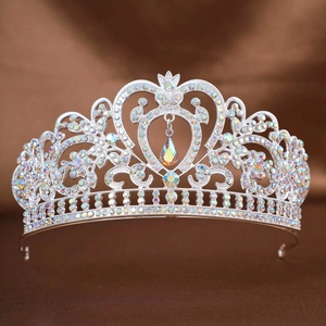 Macro shot of silver bridal crown featuring crystal heart and teardrop pendant