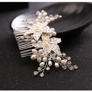 Elegant silver bridal hair comb with white pearls and sparkling rhinestones in floral design