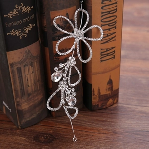 Exquisite bridal hairband featuring hollow silver flowers with rhinestones and crystals