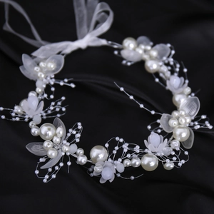 Handmade bridal headband featuring white pearls, frosted flowers and elegant ribbons