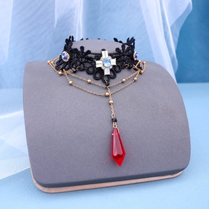 Gothic lace choker with blue rhinestones and a red drop crystal pendant detail