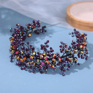 Handmade bridal headband with deep red beads and AB crystals on a vintage black wire frame