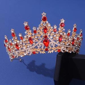 Elegant gold bridal crown with sparkling white diamonds and large red teardrop crystals