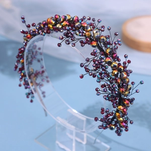 Luxurious handmade bridal headband with colorful crystals and gold beads on a black wire