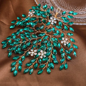 Exquisite bridal headband with emerald green rhinestones and gold leaf branch design