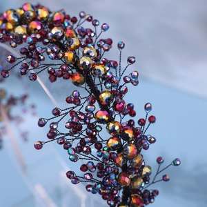 Handmade bridal headband featuring sparkling colorful crystals on intricate wire branches