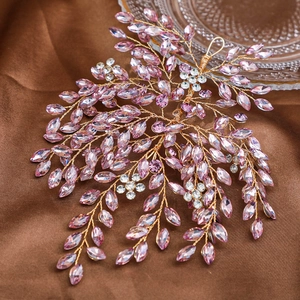 Close-up of handmade bridal headband with pink marquise rhinestones and gold wires