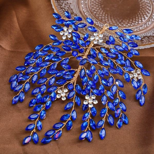 Elegant bridal hair vine with blue marquise rhinestones and gold wire on silk fabric
