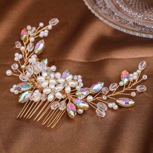 Detail of bridal hair comb featuring faux pearls and crystals on brown silk fabric