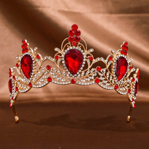 Vintage baroque crown with large red gemstones and intricate gold filigree design
