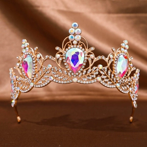 Baroque golden tiara with iridescent teardrop rhinestones and intricate diamond patterns