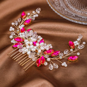 Elegant handmade pearl hair comb with rose red crystals on brown silk background