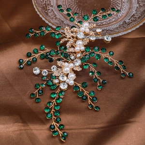 Serre-tête de mariée doré avec strass émeraude, perles et motif de feuilles