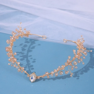 Eleganter goldener Braut-Tiara mit bernsteinfarbenen Kristallen und großem Tropfendiamant